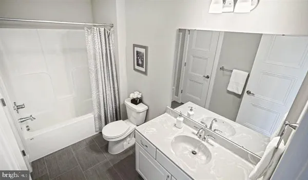 an empty room with windows and a bathroom