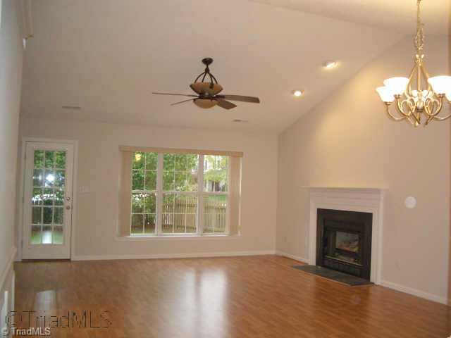 4329 Chilton Way High Point, NC 27265 - Photo 3 of 9 Other. The great room / dining room has a vaulted ceiling, fireplace, panel molding, and opens to the back yard patio.