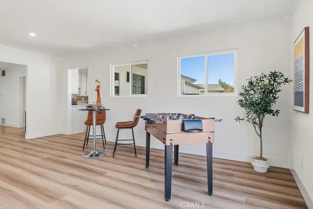 a workspace with furniture window and wooden floor