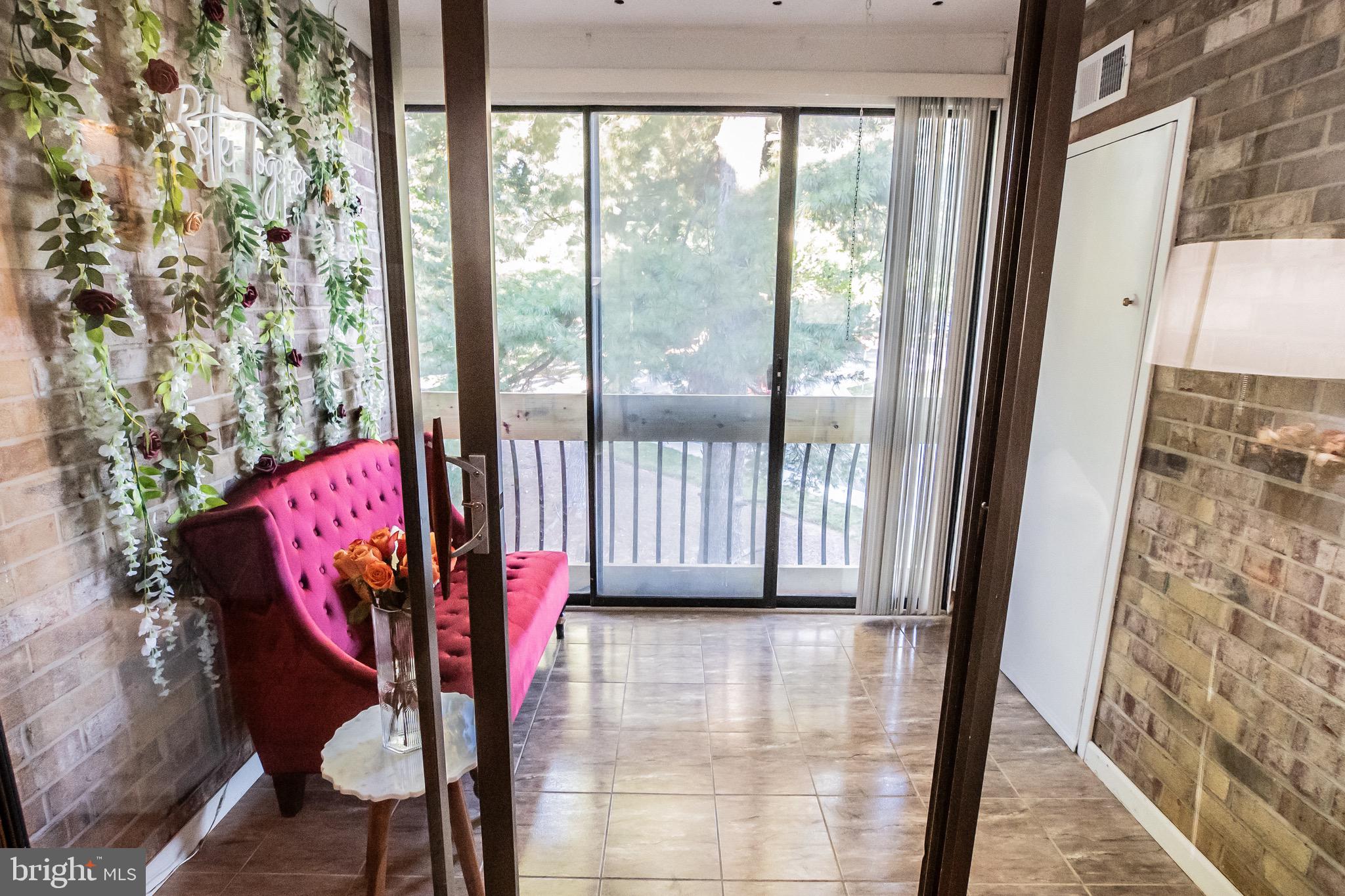 10551 Twin Rivers Road, Unit F2 Columbia, MD 21044 - Photo 18 of 21 Large glassed private patio with a view.