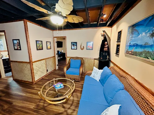 a living room with furniture and a flat screen tv