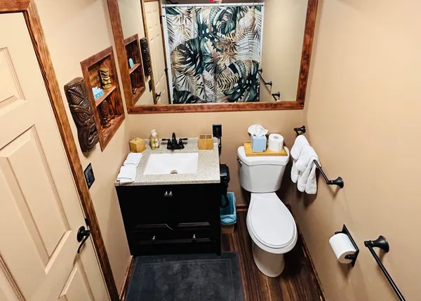 a bathroom with a toilet and a sink