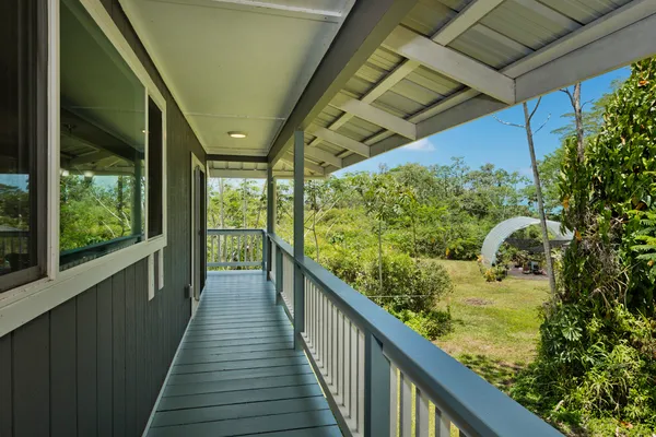 a view of balcony and yard