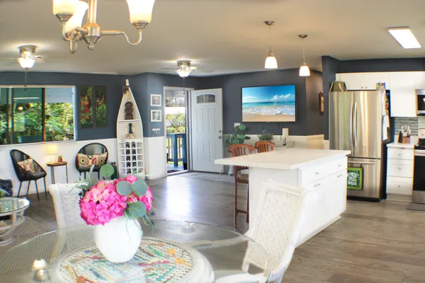 a view of living room with furniture and chandelier