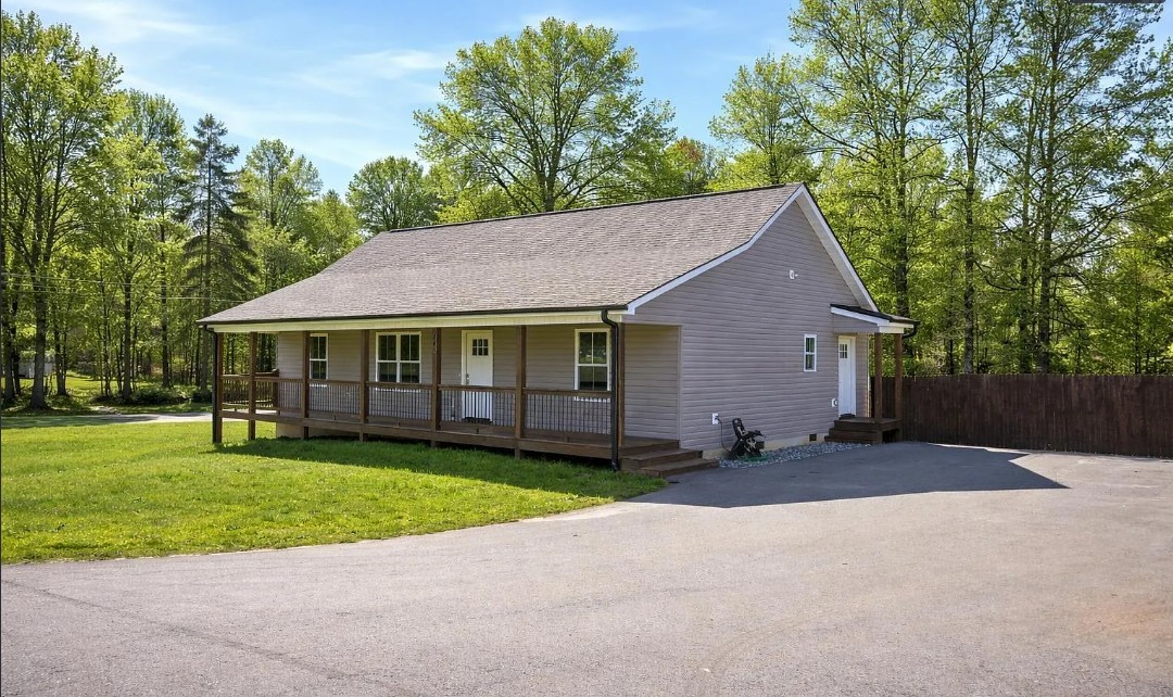 745 Dave Nix Road Seneca, SC 29678 - Photo 2 of 23 A charming, single-level residence nestled amidst abundant greenery, featuring a welcoming porch and a spacious driveway.