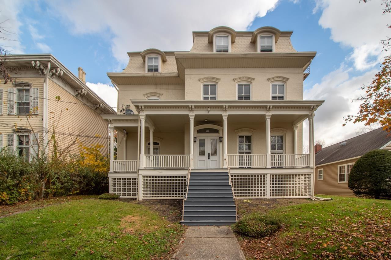 Undisclosed Address Kingston, NY 12401 - Photo 1 of 33 a front view of a house with a yard