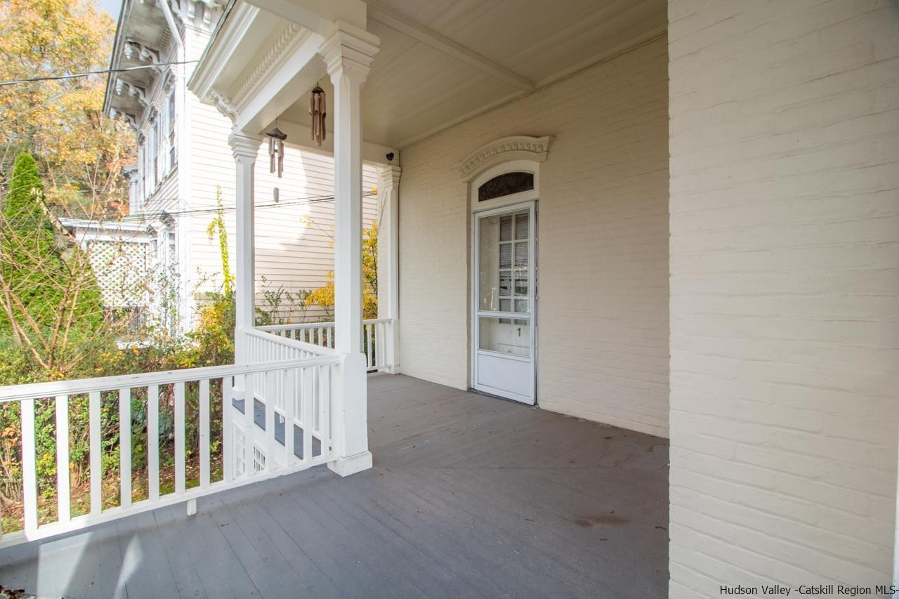 Undisclosed Address Kingston, NY 12401 - Photo 16 of 33 a view of a porch with a table and chairs