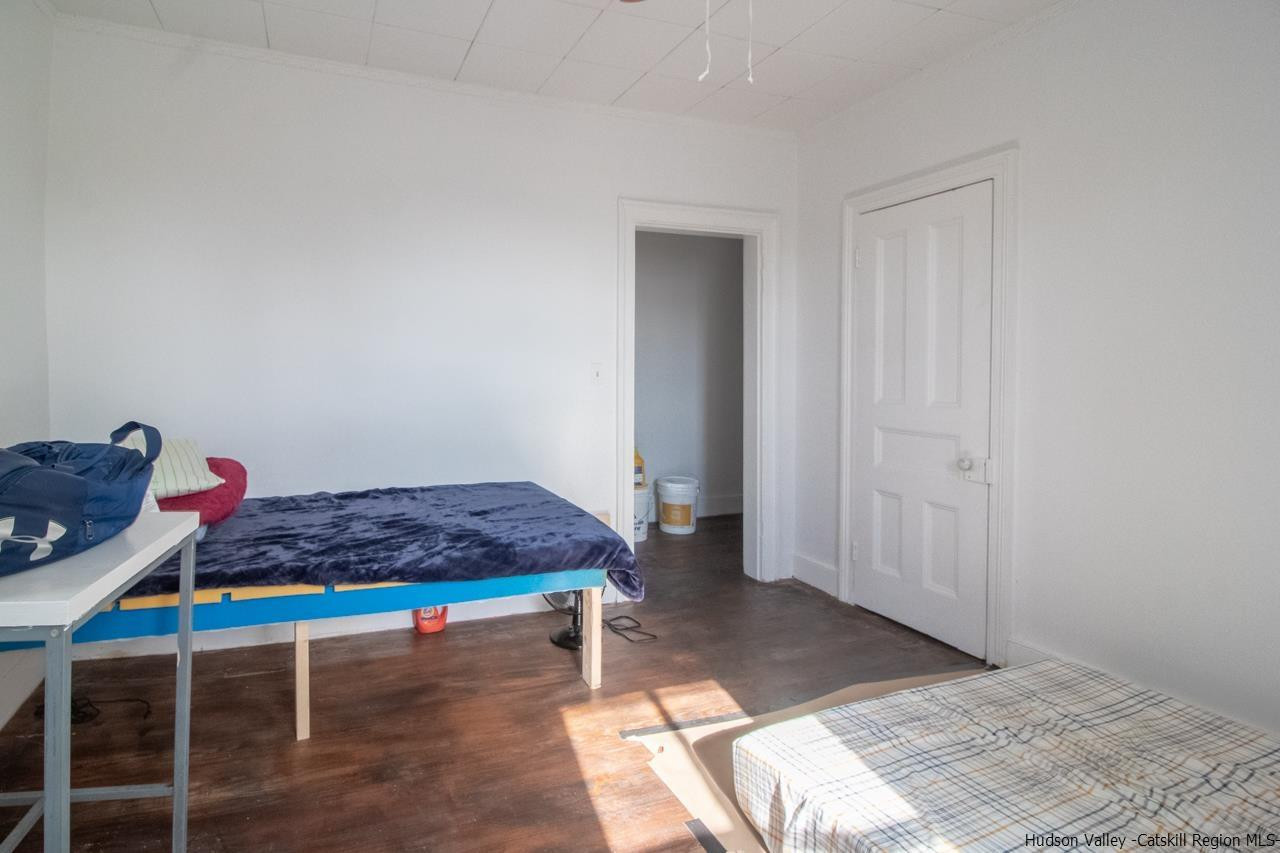 Undisclosed Address Kingston, NY 12401 - Photo 33 of 33 a living room with a table and a rug