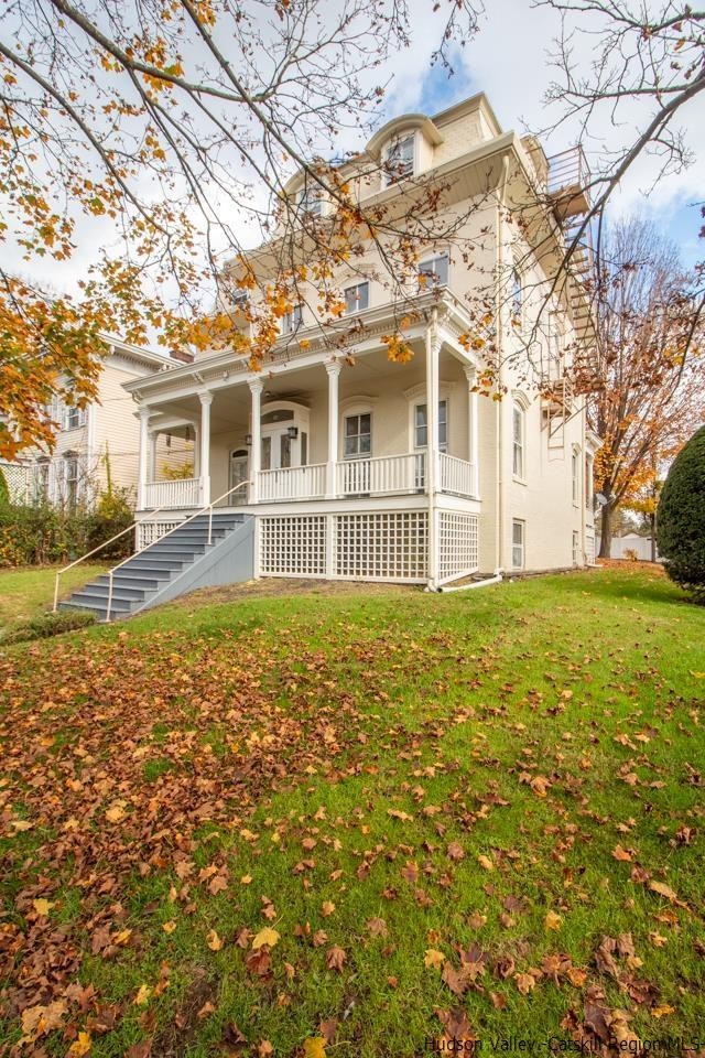 Undisclosed Address Kingston, NY 12401 - Photo 4 of 33 a front view of a house with a garden