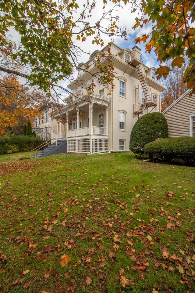 Undisclosed Address Kingston, NY 12401 - Photo 6 of 33 a view of a house with a big yard and large trees