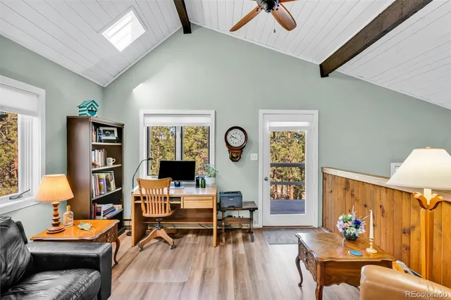 a living room with furniture and a lamp