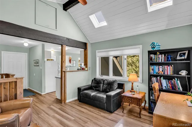 a kitchen with granite countertop a stove a sink and a refrigerator