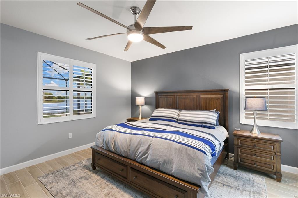 1473 Birdie Drive Naples, FL 34120 - Photo 15 of 50 a bedroom with a bed and window