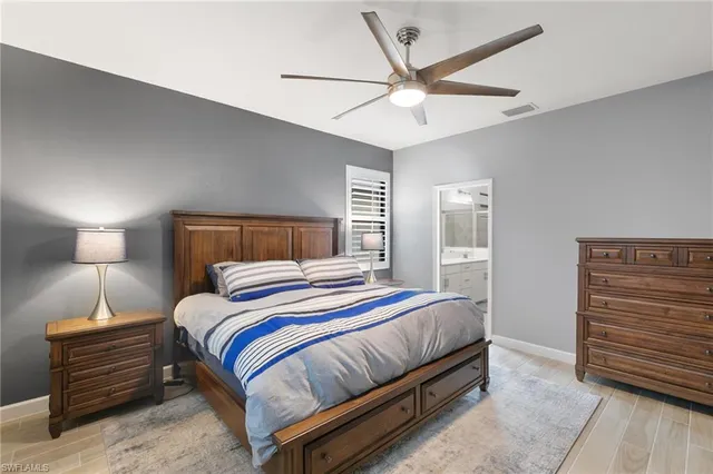 a bedroom with a bed and lamp