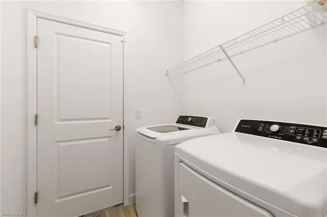 a utility room with dryer and washer