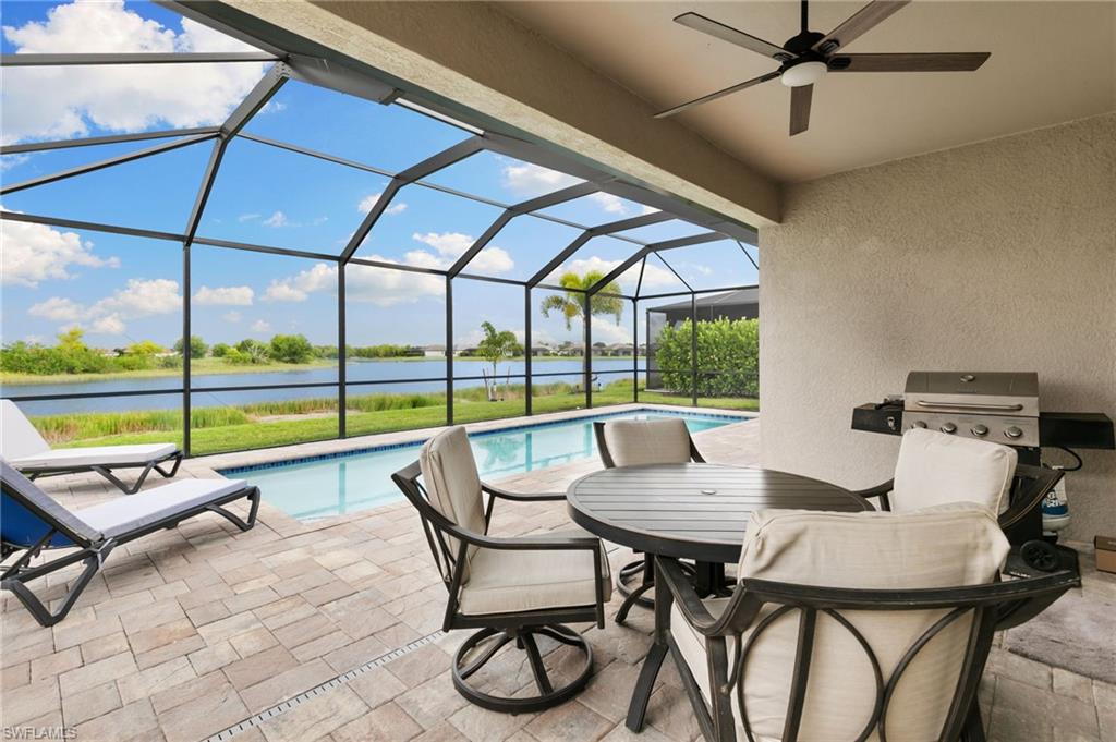 1473 Birdie Drive Naples, FL 34120 - Photo 27 of 50 a view of a dining room with furniture and floor to ceiling window