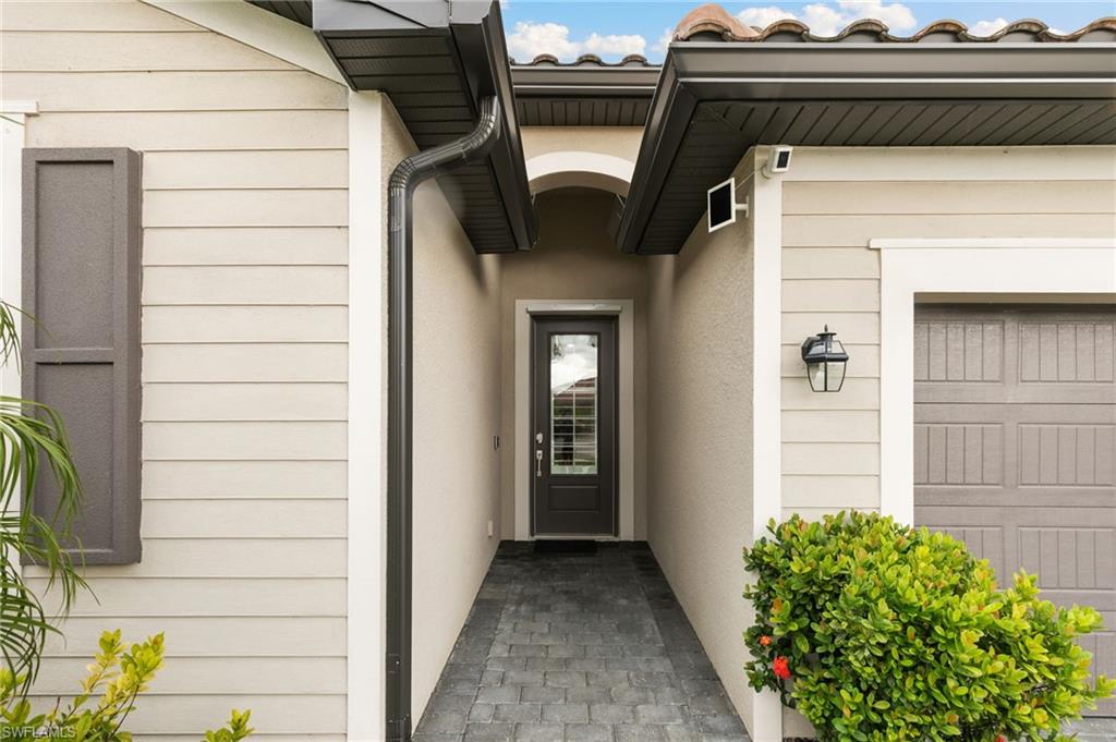 1473 Birdie Drive Naples, FL 34120 - Photo 3 of 50 a view of front door