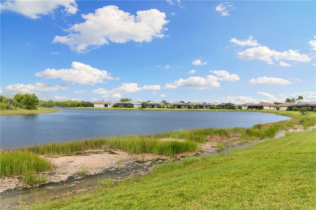 1473 Birdie Drive Naples, FL 34120 - Photo 32 of 50 a view of a lake with a mountain