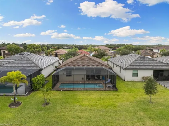 a aerial view of a house with a big yard