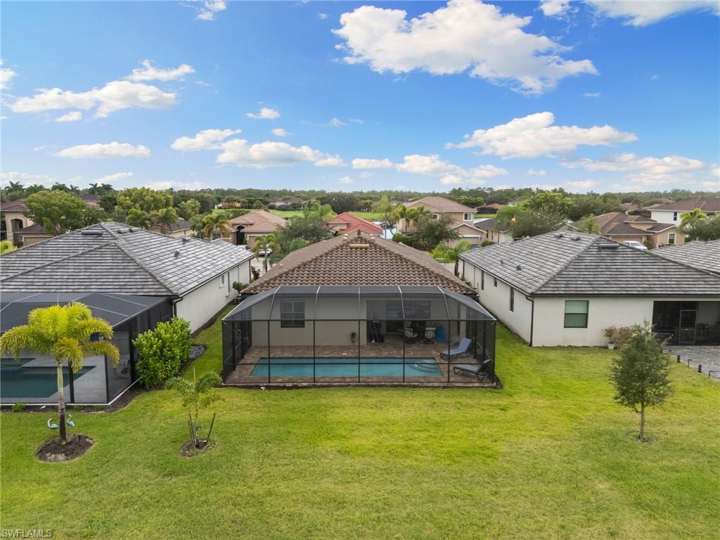 1473 Birdie Drive Naples, FL 34120 - Photo 39 of 50 a aerial view of a house with a big yard