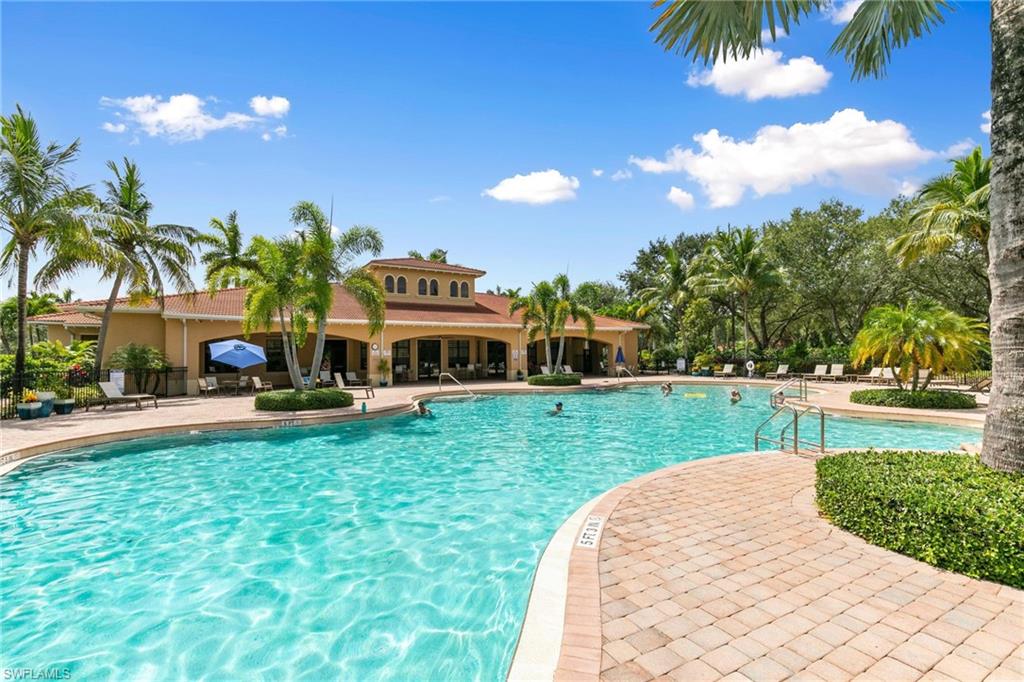 1473 Birdie Drive Naples, FL 34120 - Photo 42 of 50 a view of a house with a big yard and a garden