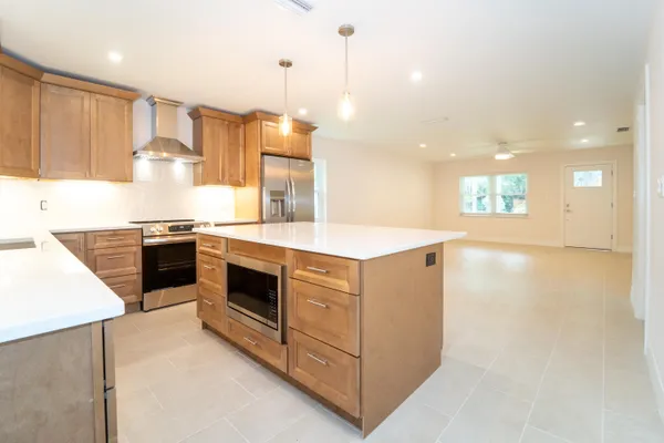 a large room with a couch and a window