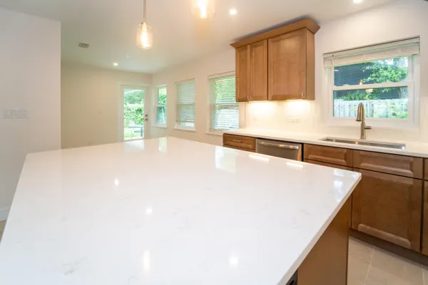 a view of a kitchen with a sink and a cabinet