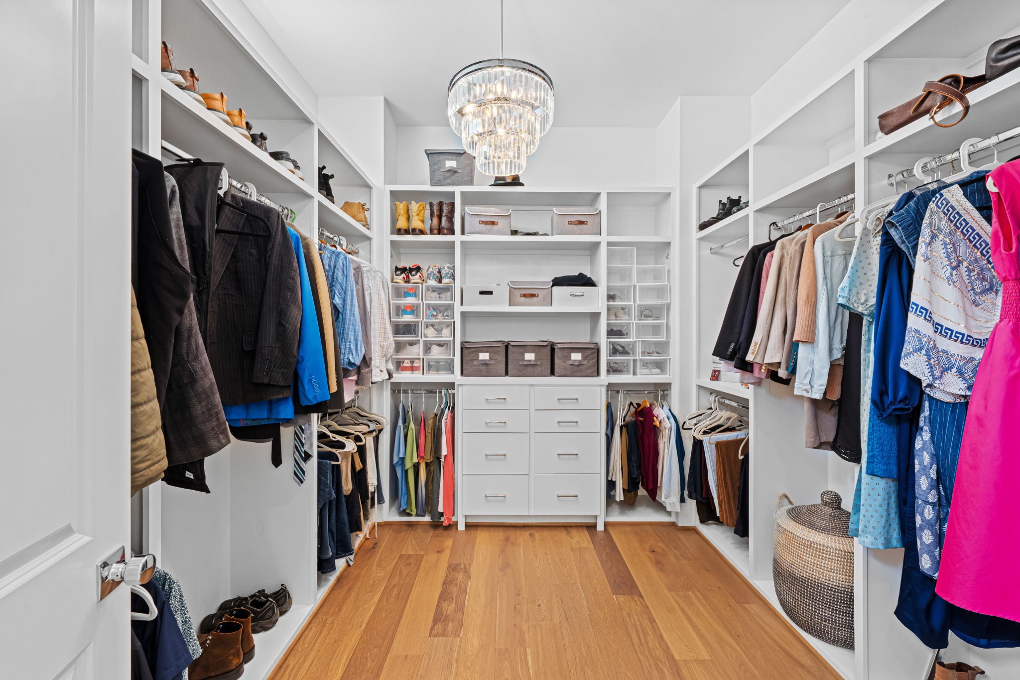 533 West 27th Street Houston, TX 77008 - Photo 15 of 22 Expansive primary closet with built-ins, extensive storage, and wood flooring throughout.
