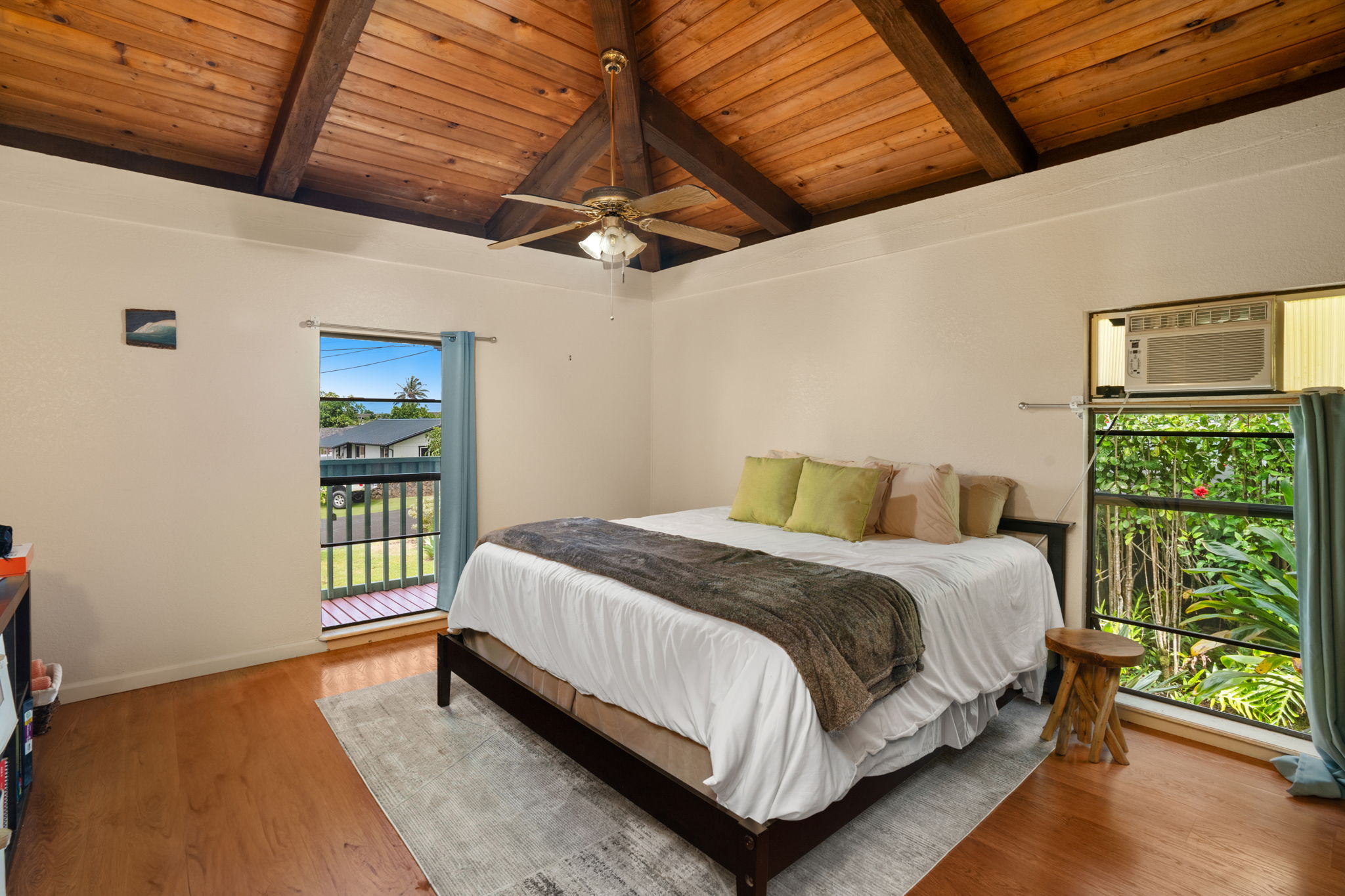 3748 Kikee Road Kalaheo, HI 96741 - Photo 14 of 27 a bed sitting in a bedroom next to a window