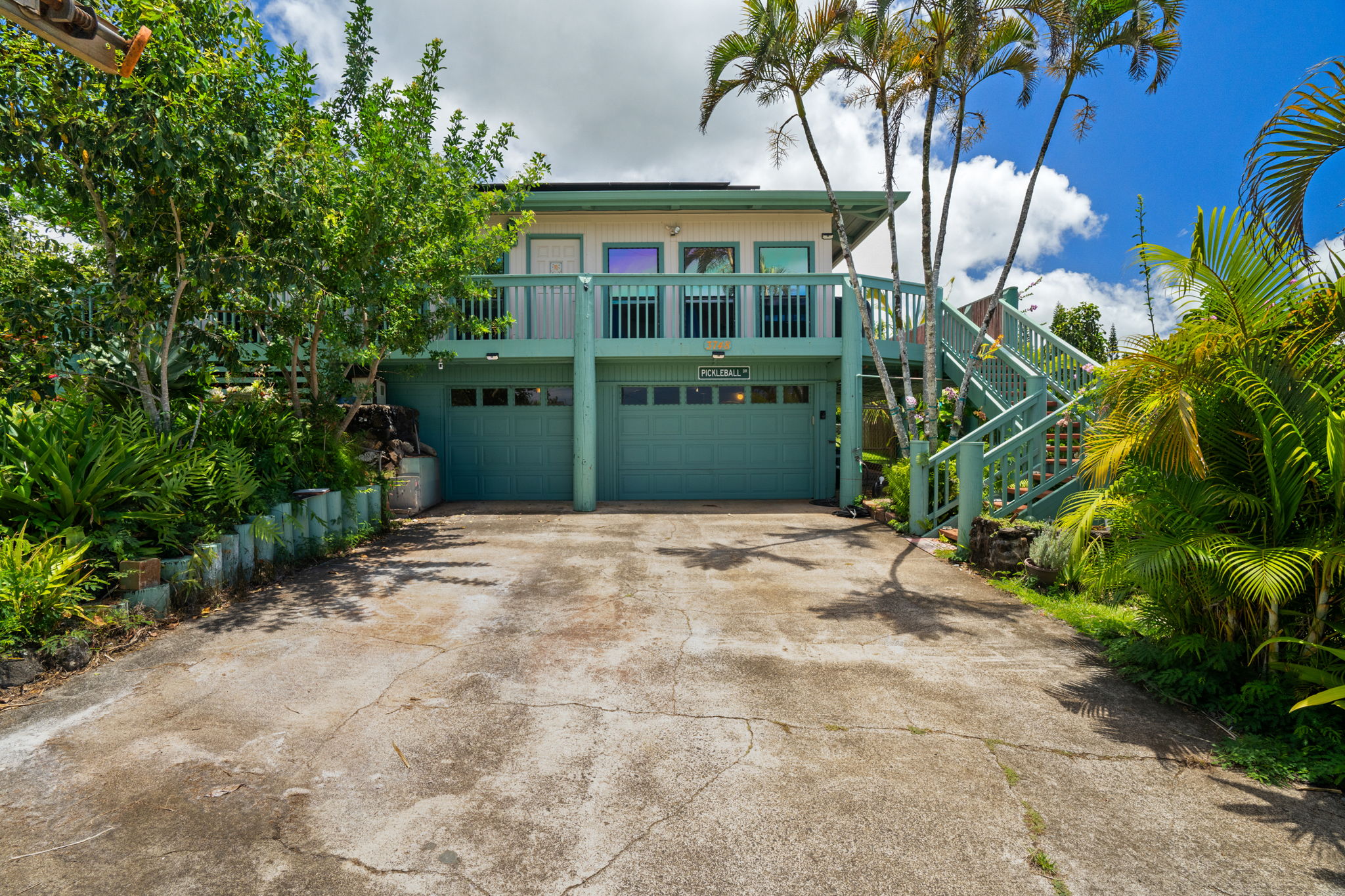3748 Kikee Road Kalaheo, HI 96741 - Photo 16 of 27 a front view of a house with a yard and garage