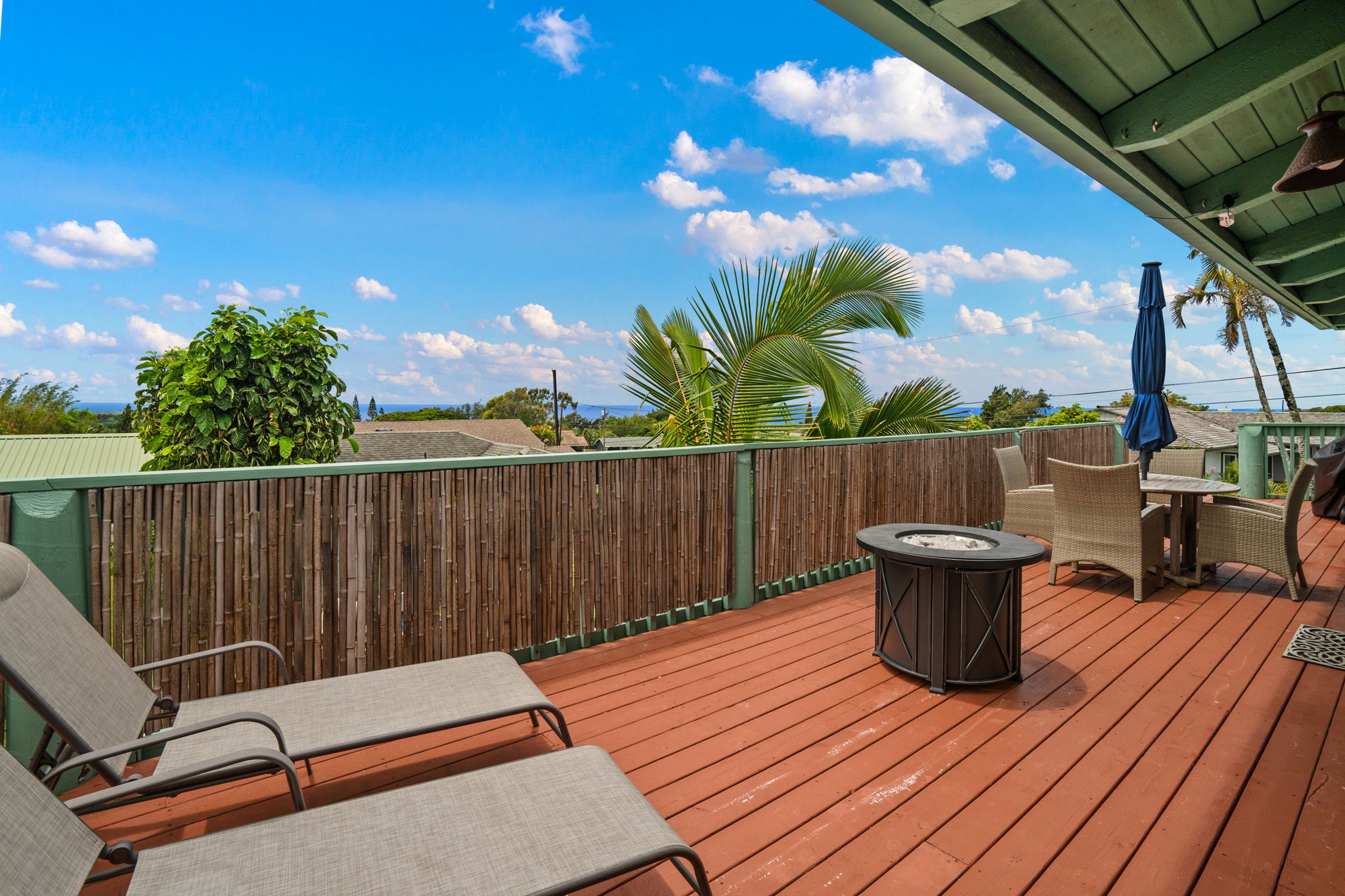 3748 Kikee Road Kalaheo, HI 96741 - Photo 3 of 27 a backyard of a house with table and chairs