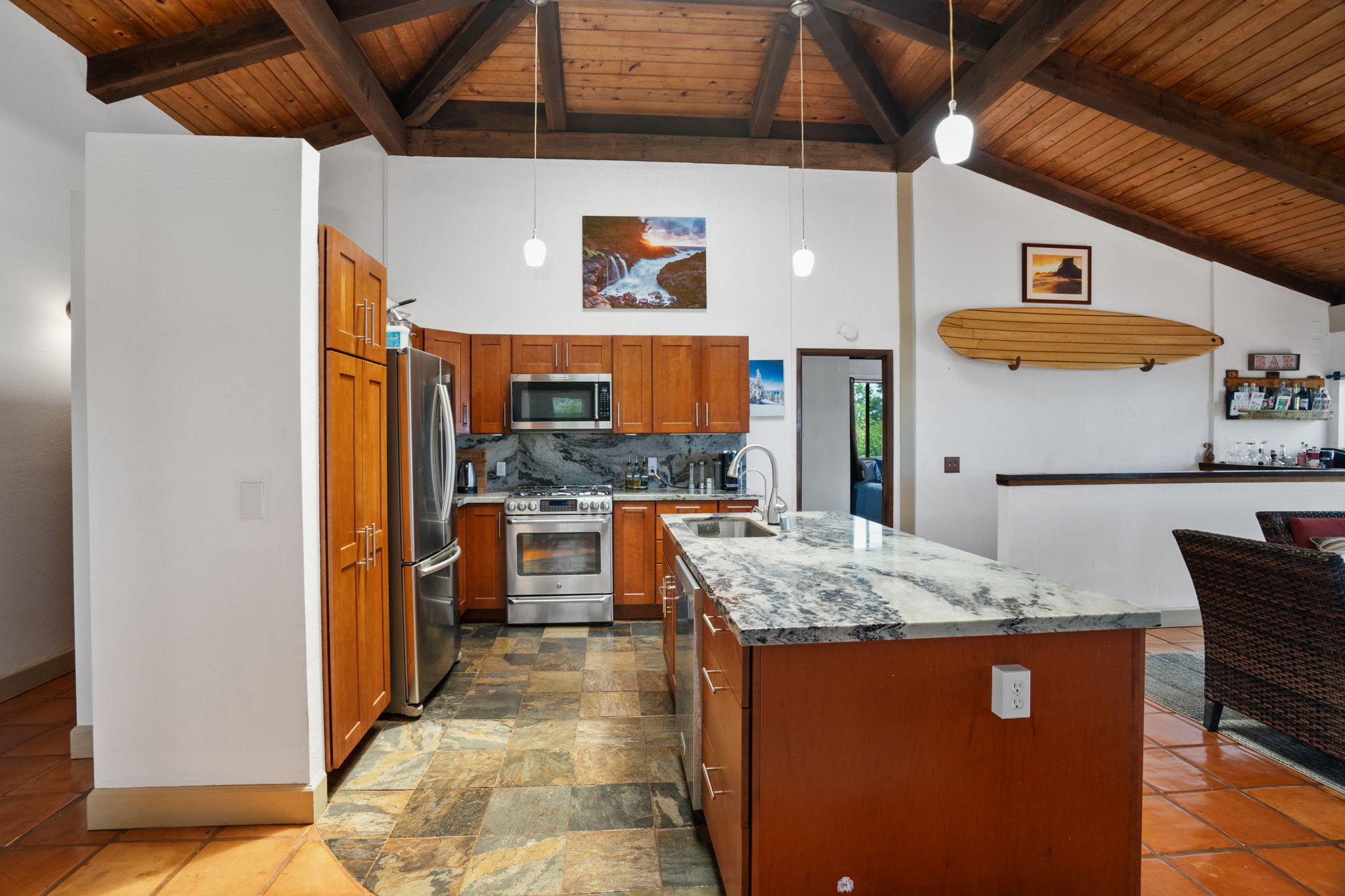 3748 Kikee Road Kalaheo, HI 96741 - Photo 5 of 27 a kitchen with stainless steel appliances granite countertop sink stove and refrigerator