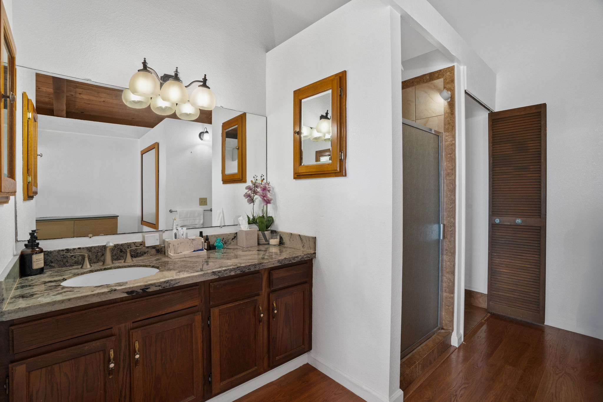 3748 Kikee Road Kalaheo, HI 96741 - Photo 9 of 27 a bathroom with a double vanity sink and a mirror