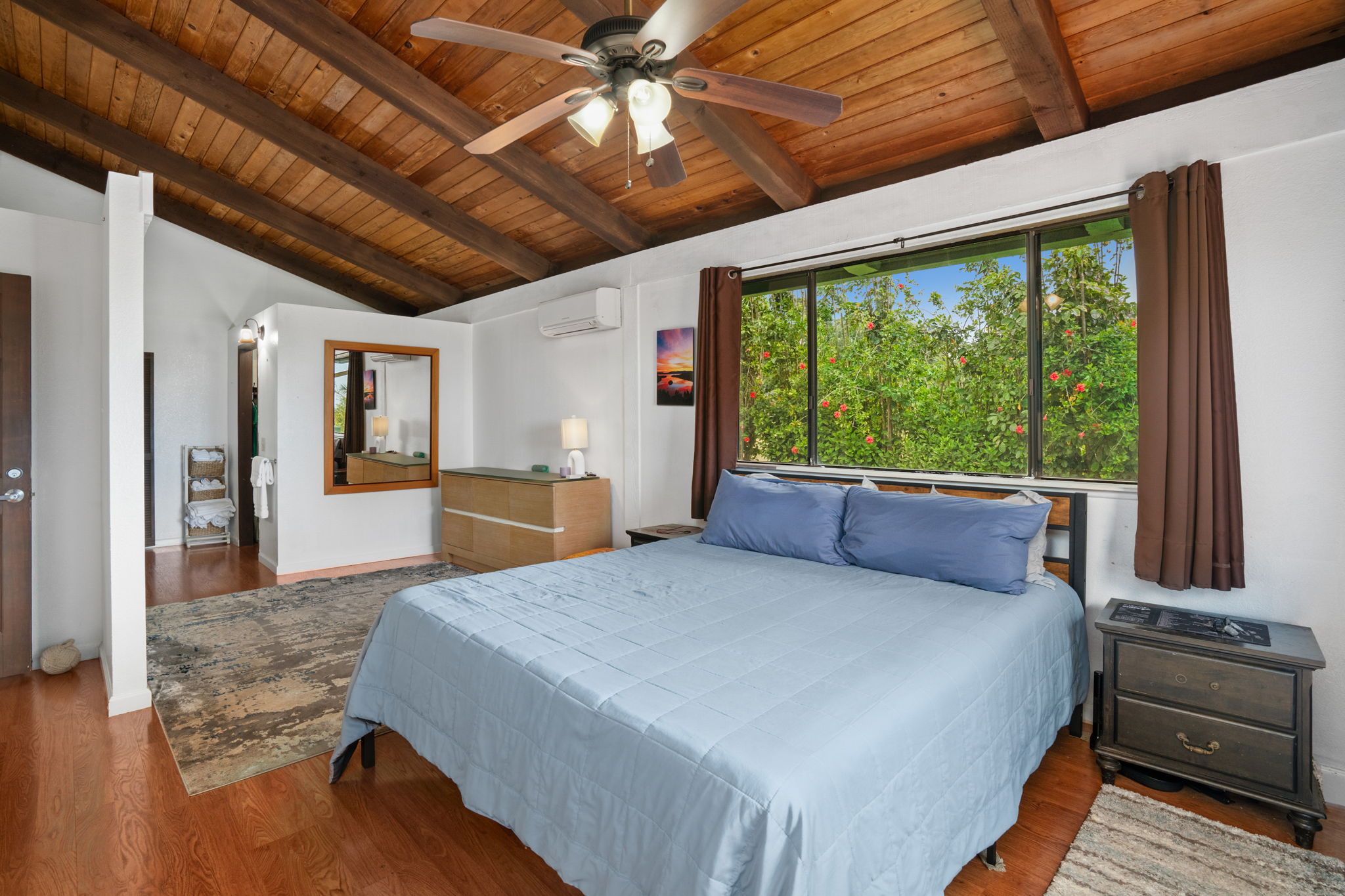 3748 Kikee Road Kalaheo, HI 96741 - Photo 10 of 27 a bedroom with a large bed and a large window