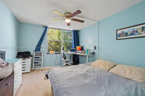 a bed room with a bed and a window