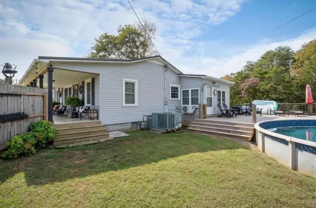 a view of a house with a chairs in patio