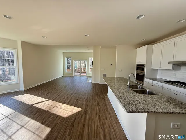a bathroom with a sink toilet and mirror