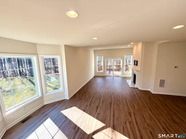 a bathroom with a granite countertop sink mirror and vanity