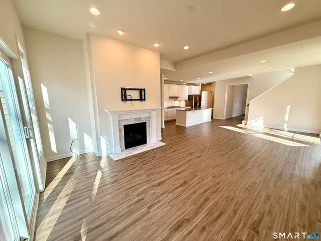 a view of an empty room with windows
