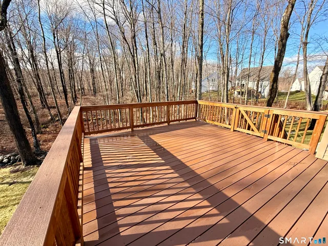 a kitchen with stainless steel appliances granite countertop a stove a refrigerator a table and chairs