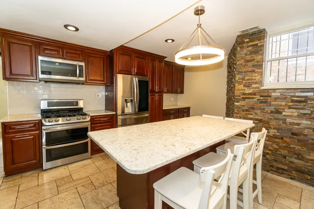 a kitchen with a stove and a microwave