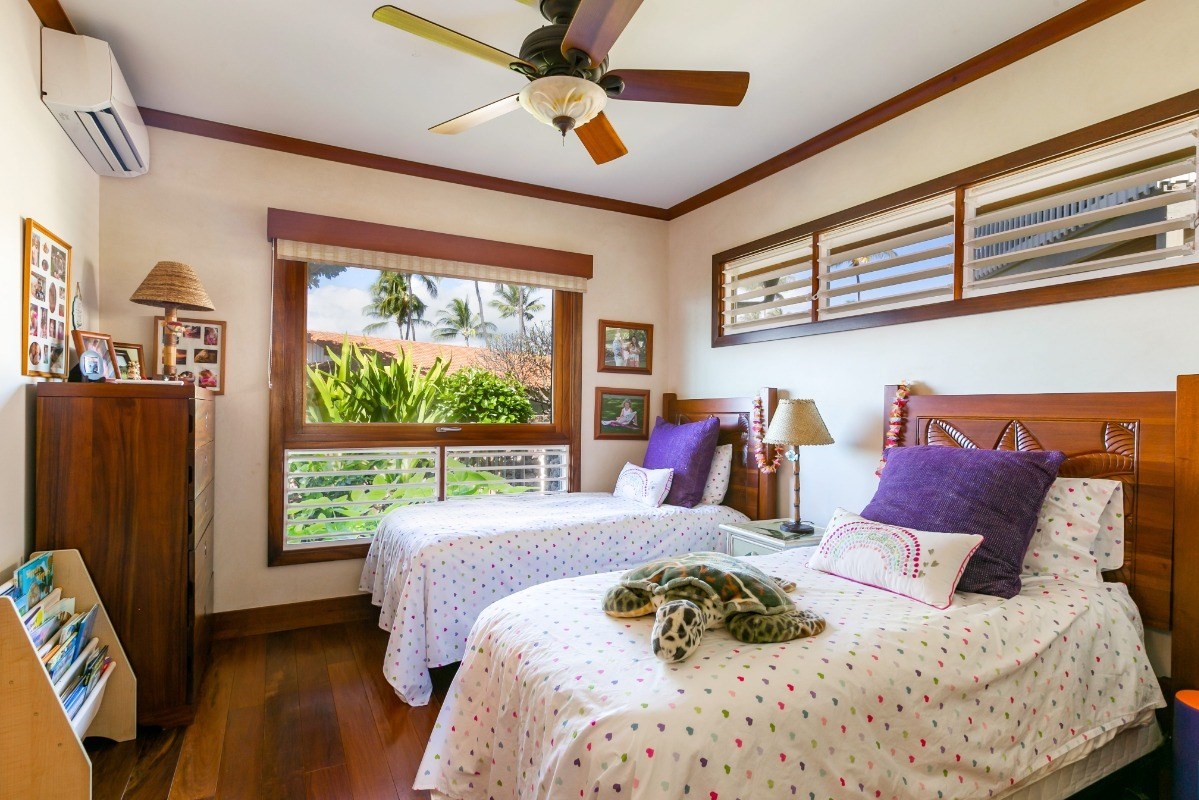 1871 Pe'e Road, Unit 1 Koloa, HI 96756 - Photo 13 of 24 a bed sitting in a bedroom next to a window