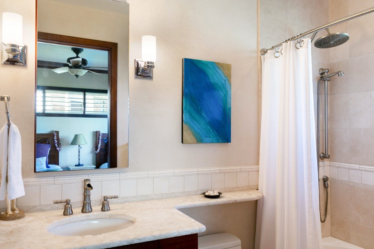 1871 Pe'e Road, Unit 1 Koloa, HI 96756 - Photo 14 of 24 a bathroom with a sink and a mirror