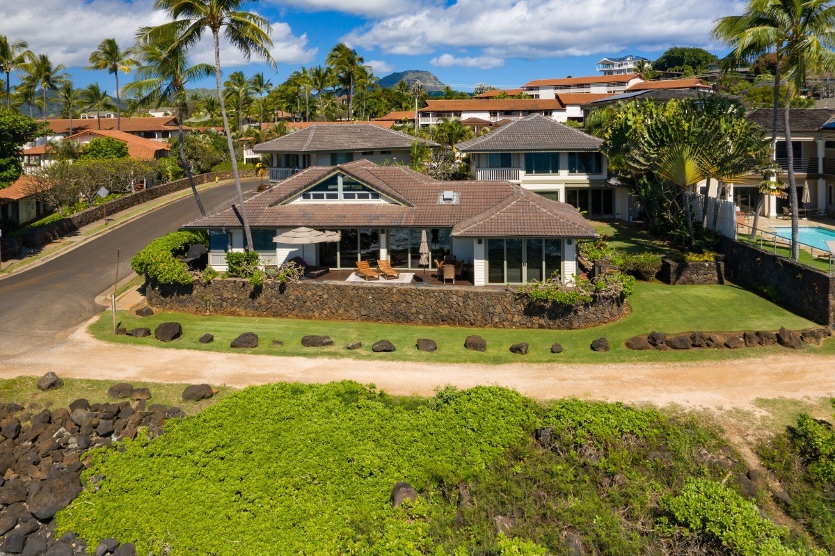 1871 Pe'e Road, Unit 1 Koloa, HI 96756 - Photo 16 of 24 a view of a house with a yard and potted plants