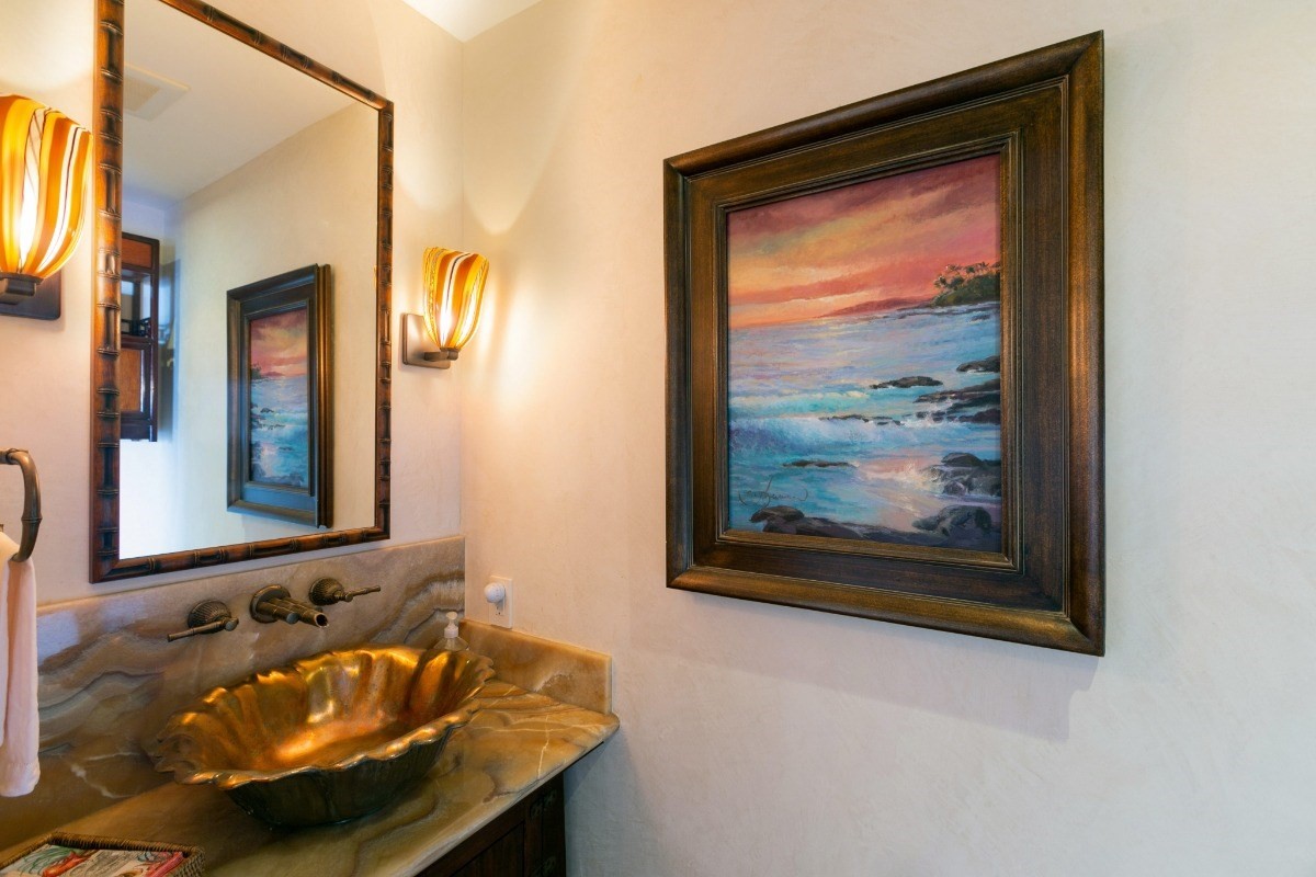 1871 Pe'e Road, Unit 1 Koloa, HI 96756 - Photo 21 of 24 a bathroom with a sink and a mirror