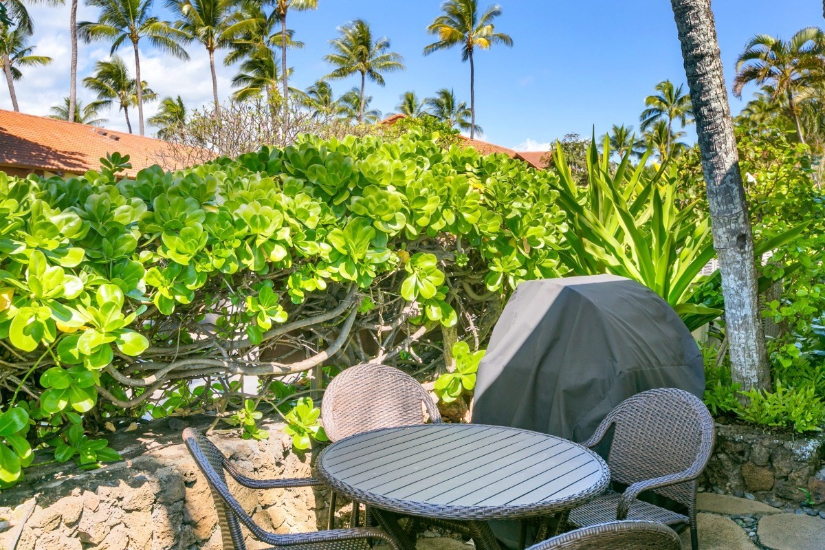 1871 Pe'e Road, Unit 1 Koloa, HI 96756 - Photo 23 of 24 a backyard of a house with table and chairs