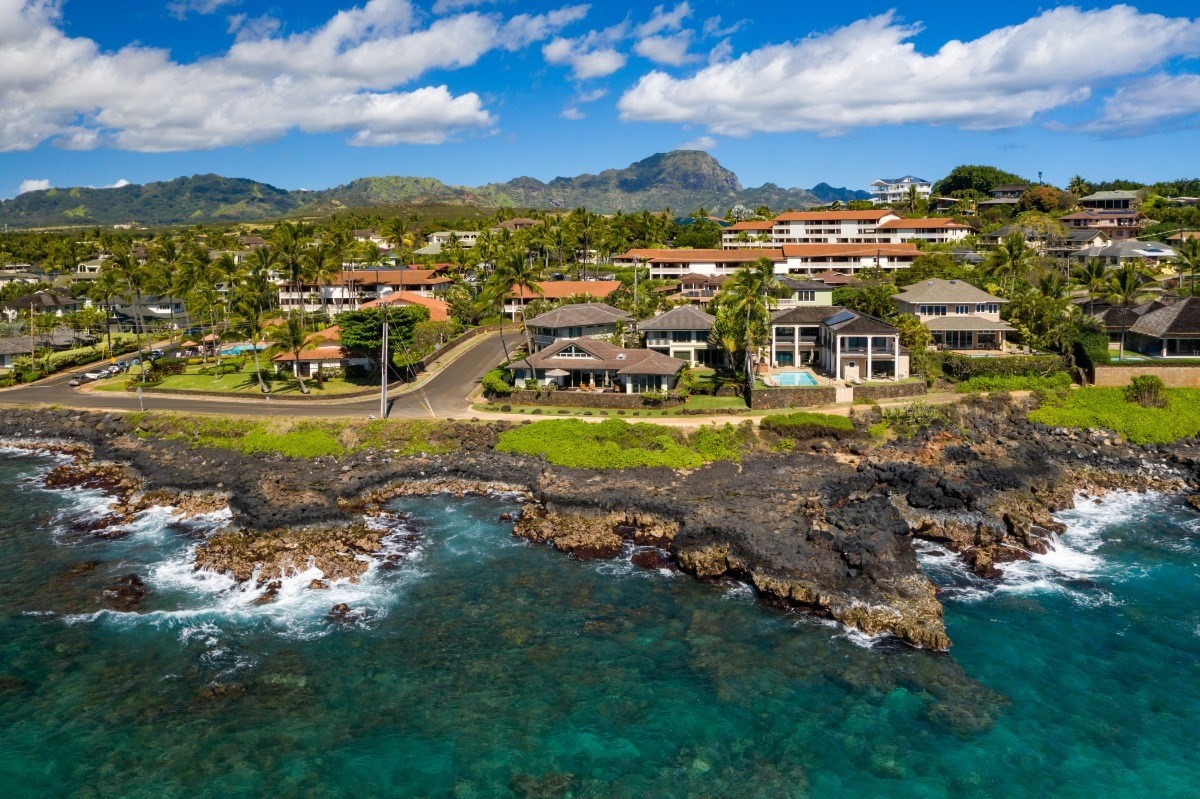 1871 Pe'e Road, Unit 1 Koloa, HI 96756 - Photo 6 of 24 a view of a town with mountains in the background