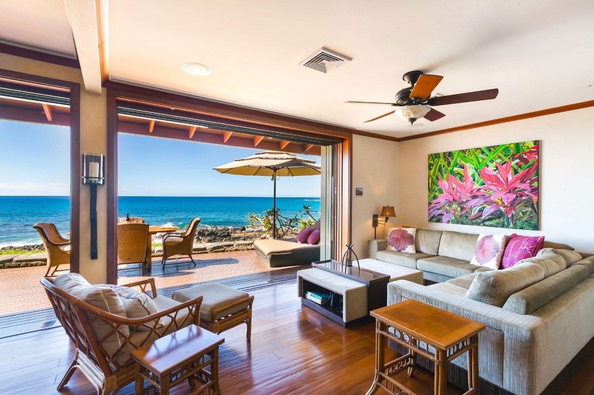 1871 Pe'e Road, Unit 1 Koloa, HI 96756 - Photo 7 of 24 a living room with furniture and a flat screen tv