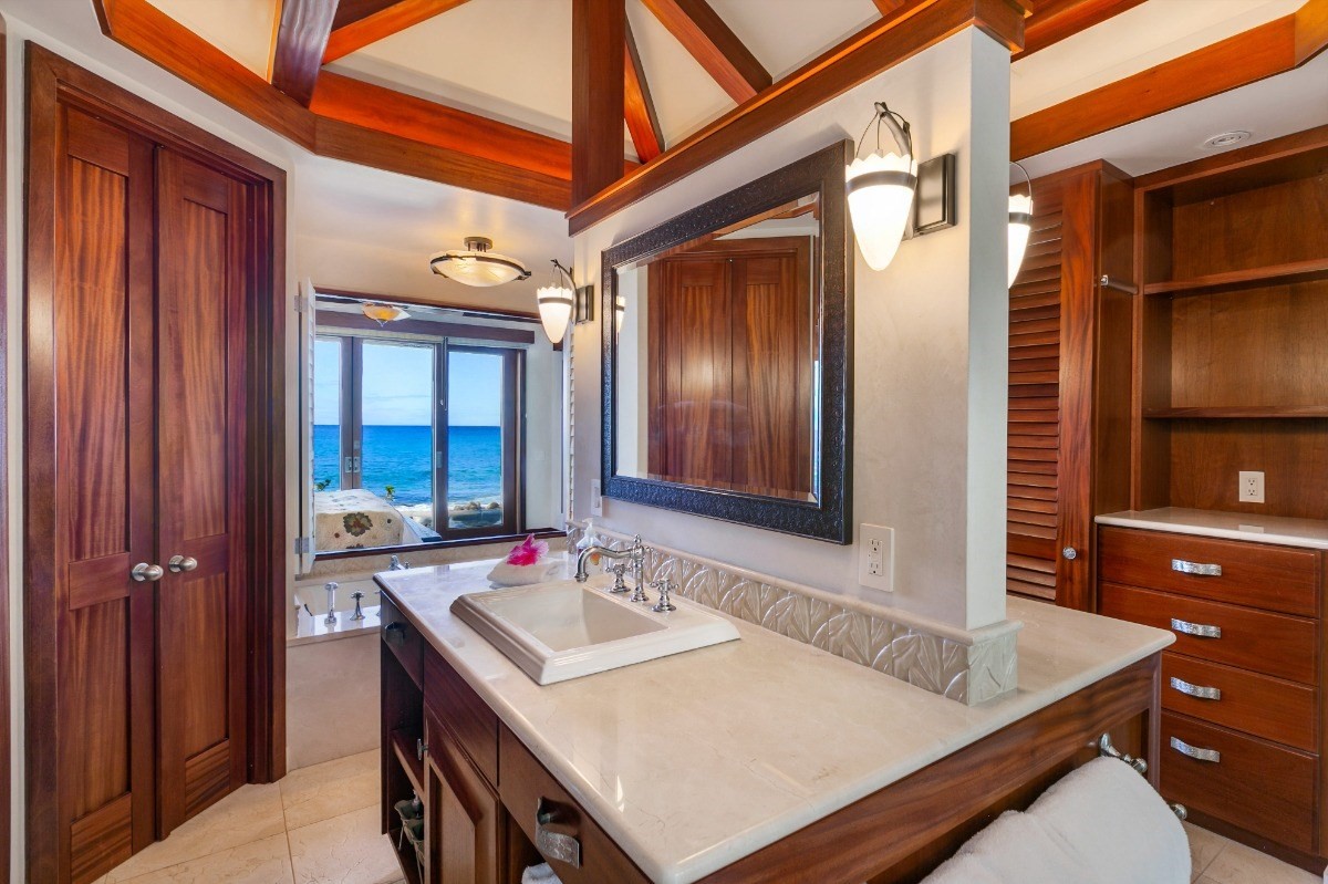 1871 Pe'e Road, Unit 1 Koloa, HI 96756 - Photo 10 of 24 a bathroom with a sink a vanity and a mirror