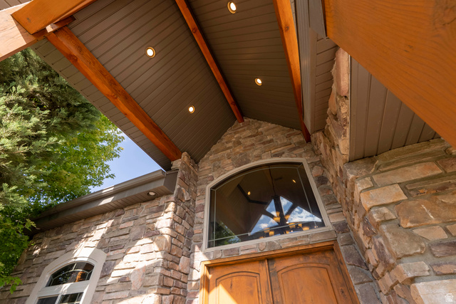 687 South 2080th Street East Springville, UT 84663 - Photo 124 of 149 Stone facade featuring a large arched window above double wooden entry doors